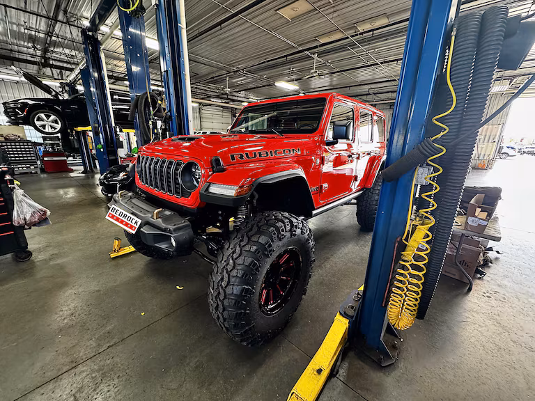 Bedrock Motors service technician working on a vehicle